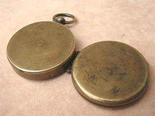 Underside view of brass compass body & lid